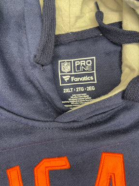 Navy jacket with orange lettering and a visible brand label